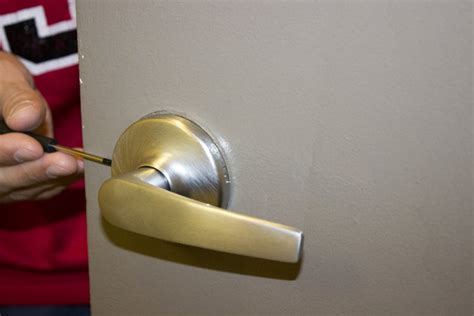 how to remove a door handle with no screws|Remove door handle / knob without screws visible .